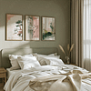 A cozy bedroom with sage-green walls and soft lighting. Above the bed with white linens, three nature-themed prints from a Japandi Wall Art Set evoke calm and serenity.
