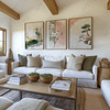 A cozy living room with a white sofa and green cushions. Above the couch, three framed nature-themed prints from the Japandi Wall Art Set enhance the serene decor.
