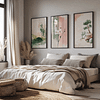 A cozy bedroom with a large bed, soft pillows, and a beige blanket. Three nature-inspired paintings from the Japandi Wall Art Set hang above, creating a calming atmosphere.