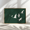 Framed Japandi Wall Art featuring white cranes in flight on a deep green background. Soft shadows cast on the wall create a serene and elegant atmosphere.