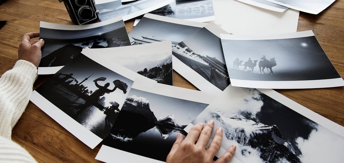 female-hands-selecting-photos