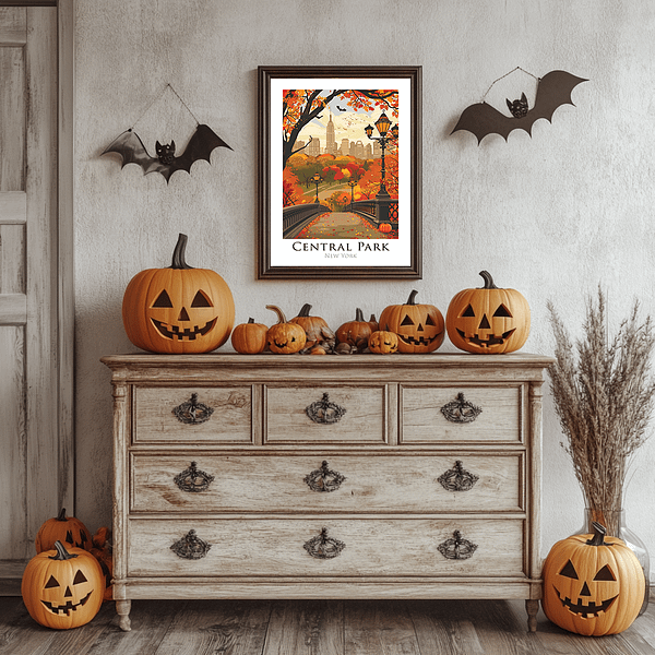 A cozy room filled with carved pumpkins and a framed Halloween NYC Art showcasing Central Park’s iconic bridge under an autumn sky. The artwork's fall colors harmonize with the pumpkins and rustic furniture, creating a charming Halloween atmosphere.