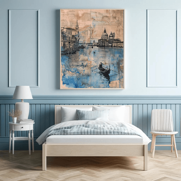 Venice digital art is displayed in a light wood frame on a light blue wall above a minimalist bed. The room's soft coastal hues enhance the artwork’s calming blue tones, creating a serene atmosphere.