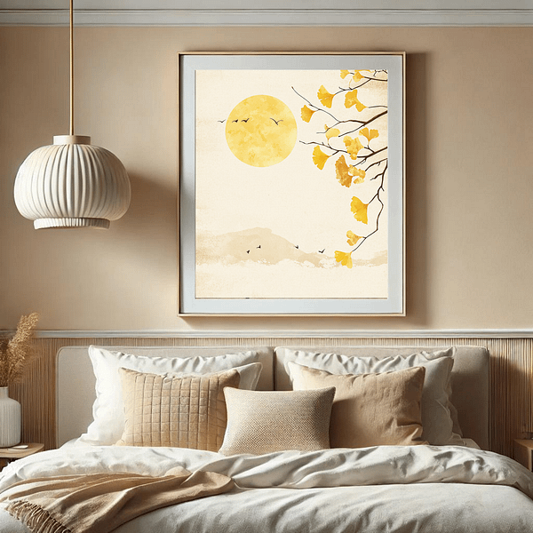 Japandi Ginkgo Art Autumn hangs above a bed in a minimalist bedroom with soft beige and cream tones. The picture, featuring golden ginkgo leaves and the sun, blends harmoniously with the cozy natural textiles, adding a calming touch to the serene room.