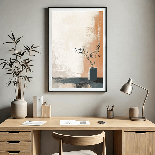 This minimalist home office setting features Japandi minimalist wall art above a wooden desk. The artwork's calming, neutral colors and simple plant design enhance the workspace's clean and focused atmosphere.